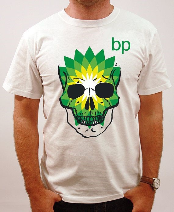 Man wearing t-shirt with green skull logo